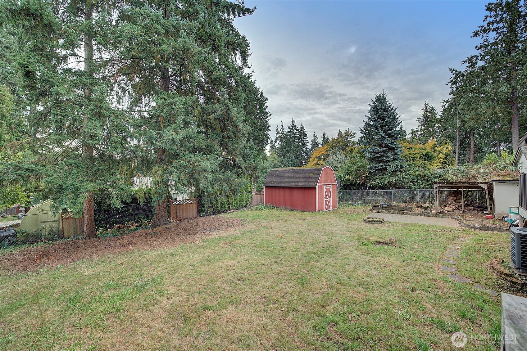 35814 11th Avenue Southwest Federal Way, WA 98023 - Photo 23 of 24 a backyard of a house with table and chairs