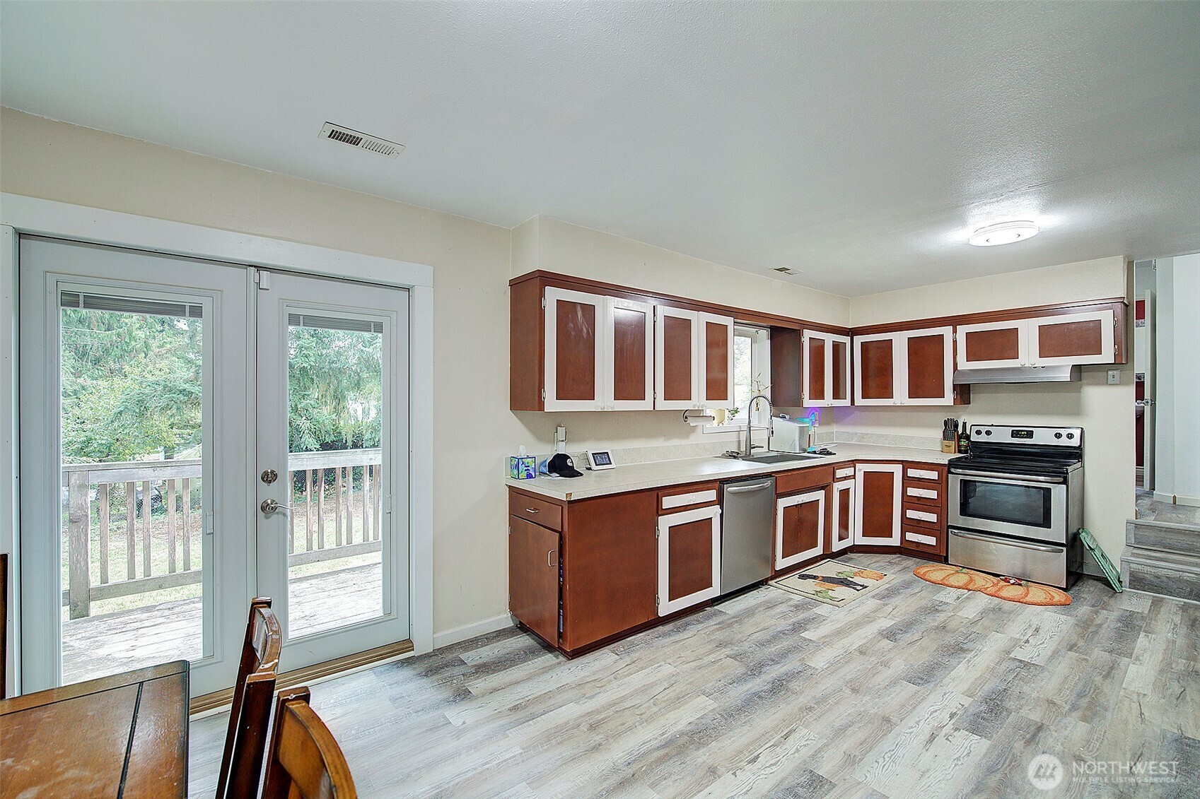 35814 11th Avenue Southwest Federal Way, WA 98023 - Photo 7 of 24 a kitchen with stainless steel appliances granite countertop a stove and a refrigerator