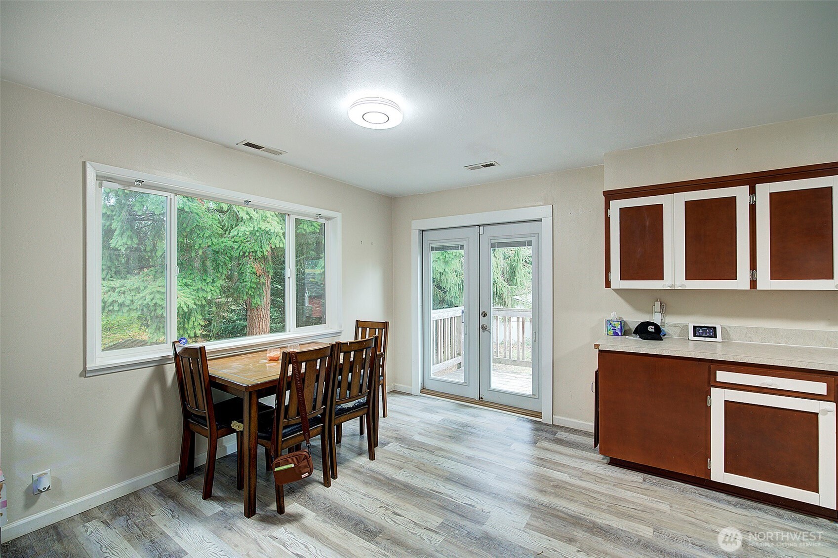 35814 11th Avenue Southwest Federal Way, WA 98023 - Photo 8 of 24 a dining room with a wooden table and chairs