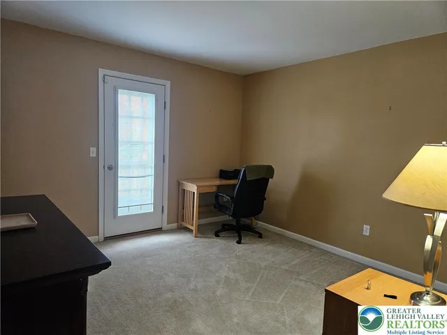 a view of a workspace with furniture