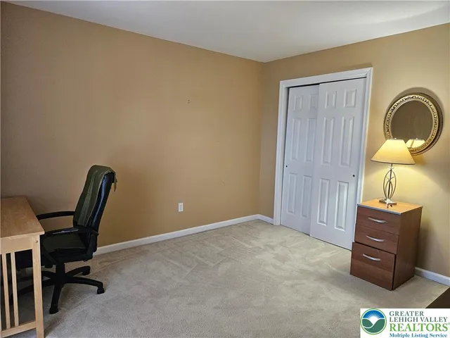 a workspace with furniture and window