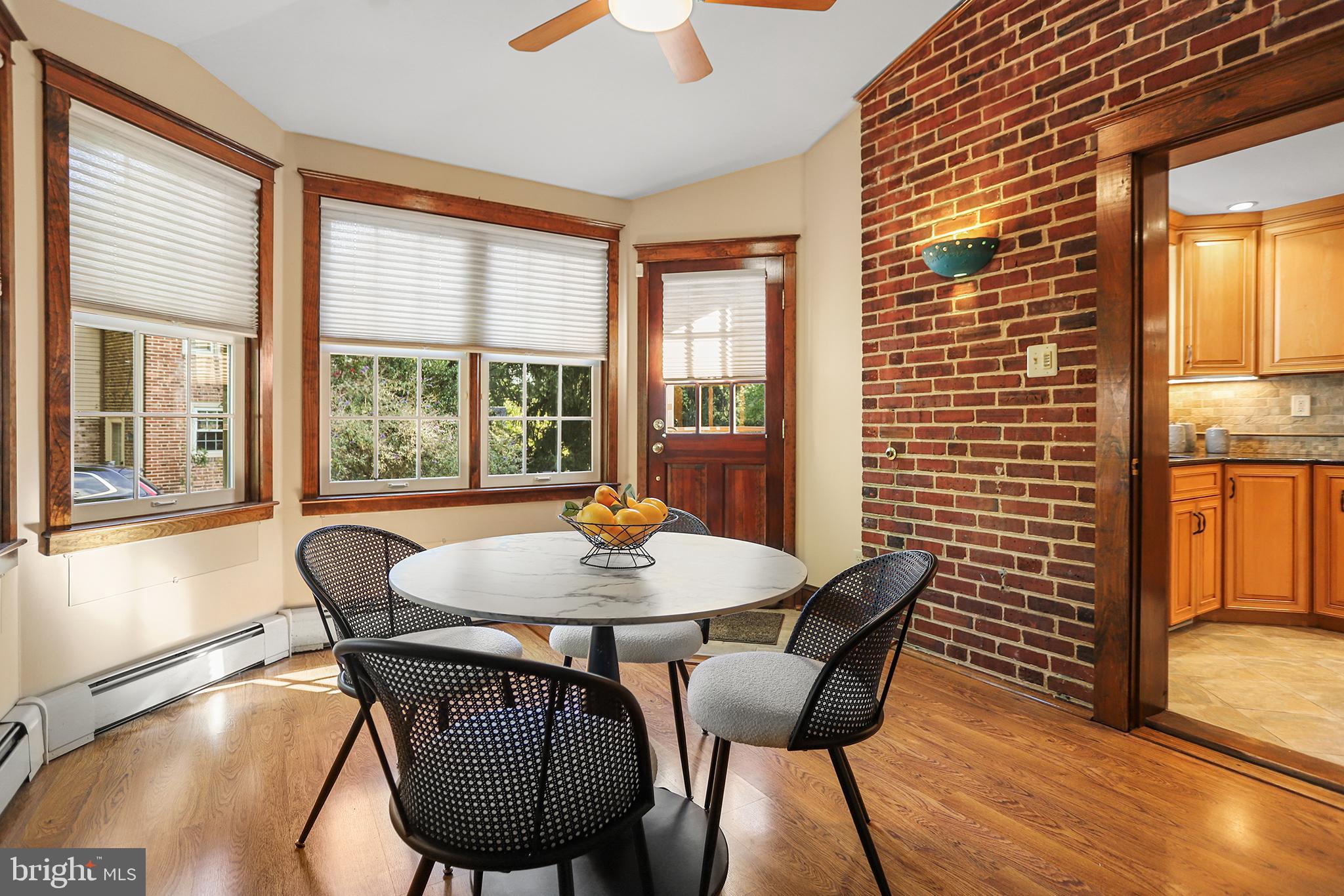 38 Green Valley Road Wallingford, PA 19086 - Photo 11 of 33 a view of a dining room with furniture window and wooden floor