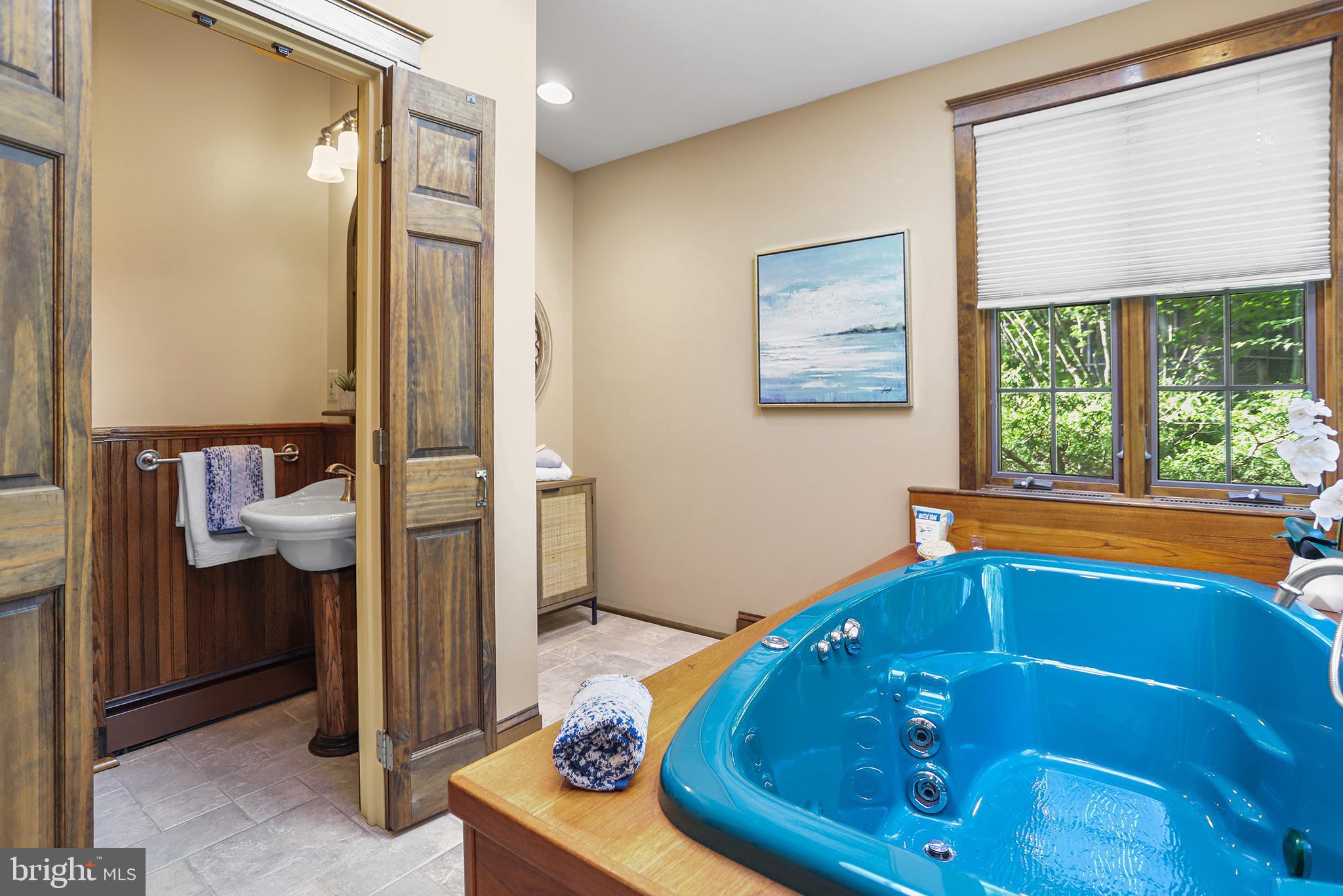 38 Green Valley Road Wallingford, PA 19086 - Photo 17 of 33 a bathroom with a sink a bath tub and a shower
