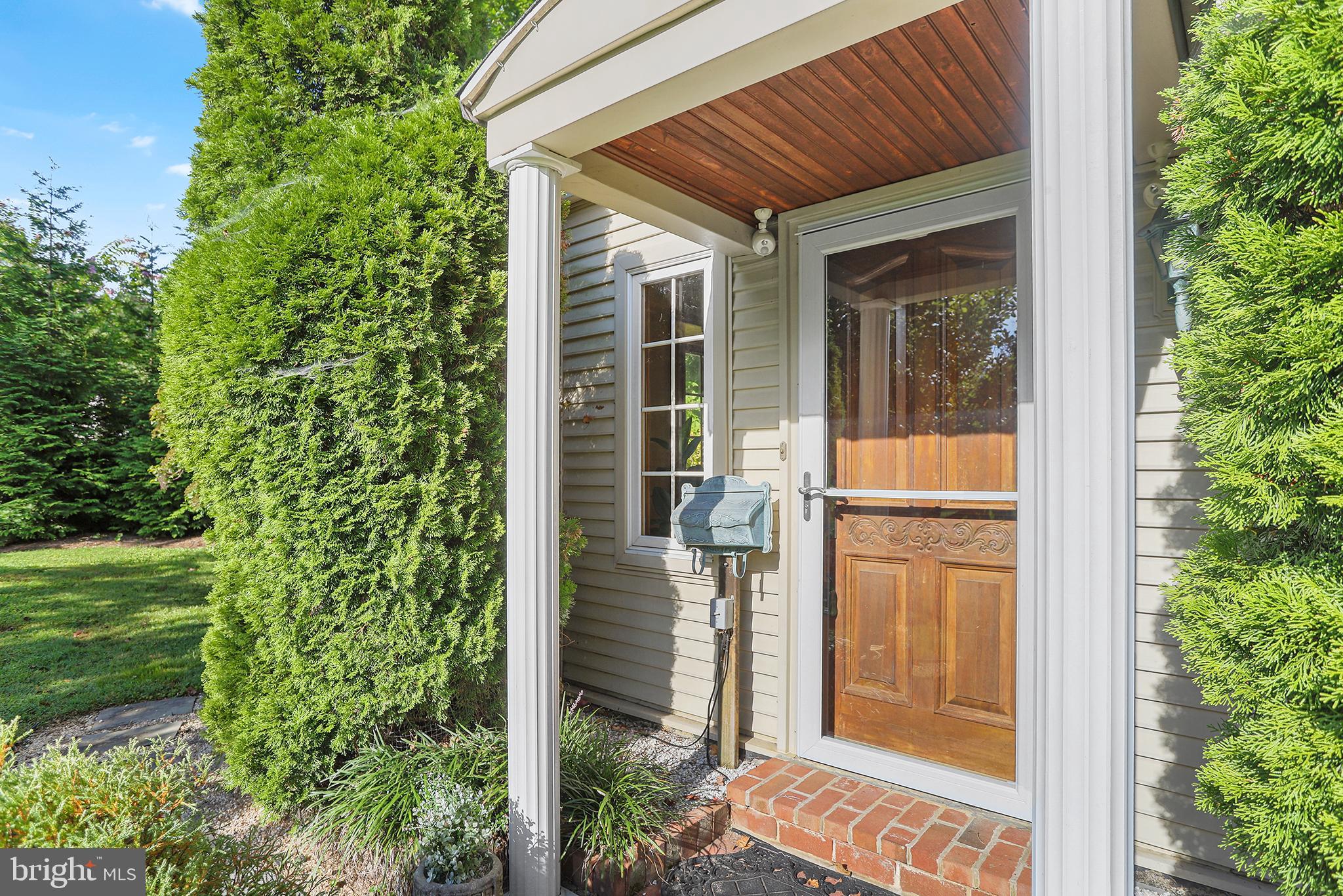 38 Green Valley Road Wallingford, PA 19086 - Photo 2 of 33 a yellow house with outdoor space