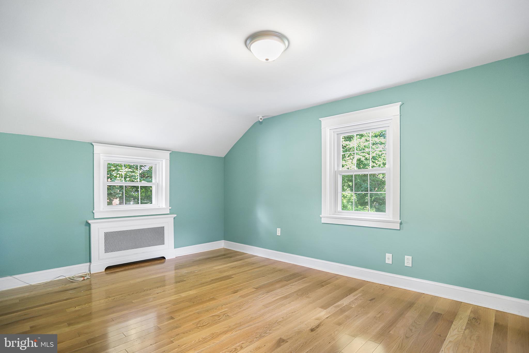 38 Green Valley Road Wallingford, PA 19086 - Photo 28 of 33 wooden floor in an empty room with a window