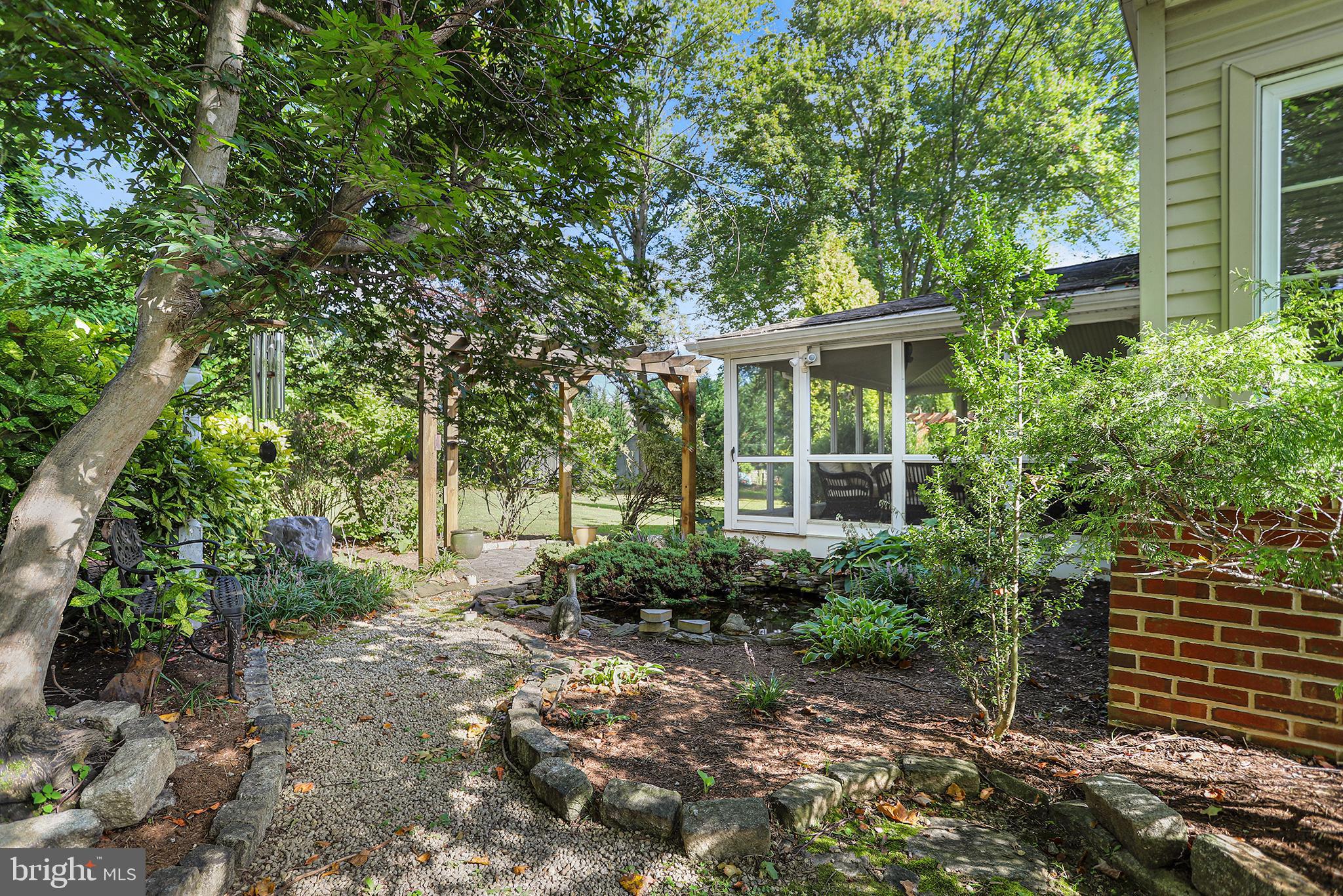 38 Green Valley Road Wallingford, PA 19086 - Photo 31 of 33 a view of a house with a garden