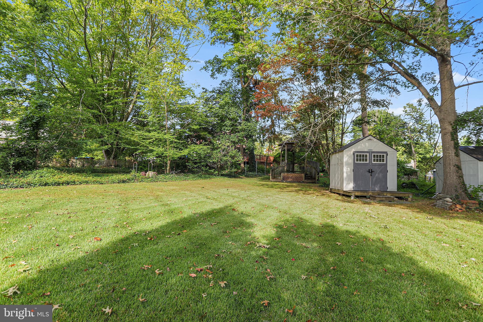 38 Green Valley Road Wallingford, PA 19086 - Photo 32 of 33 a backyard of a house with lots of green space