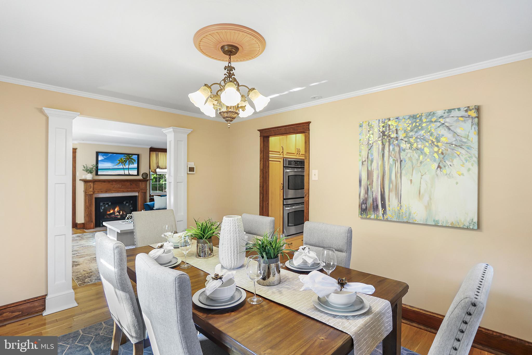 38 Green Valley Road Wallingford, PA 19086 - Photo 8 of 33 a view of a dining room with furniture wooden floor and chandelier