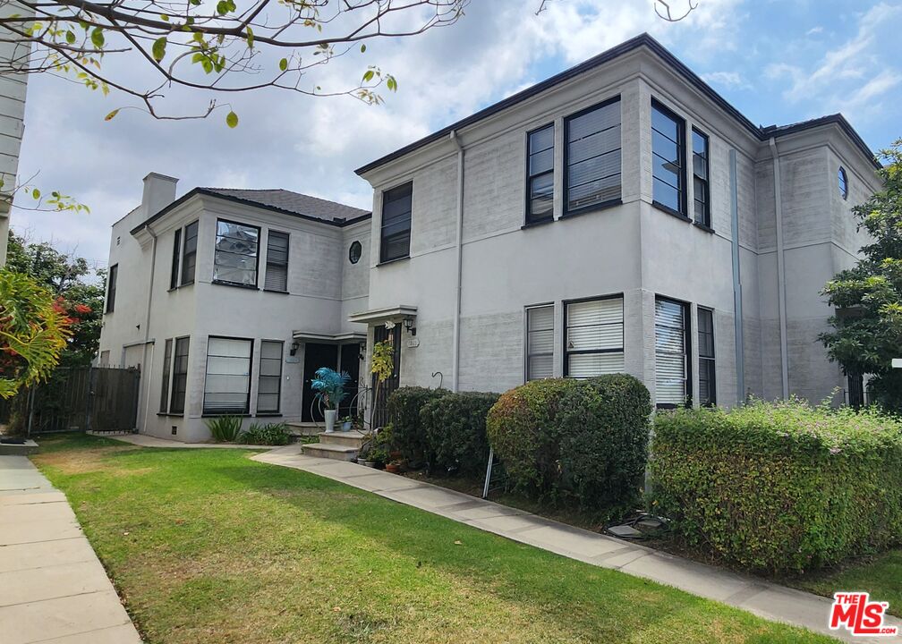 a house view with a garden space