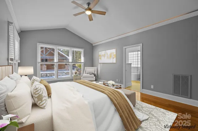 a bedroom with a large bed and a window