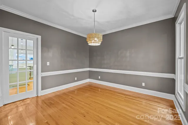 a bathroom with a window and a shower