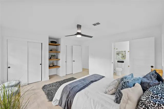 a bedroom with a bed and a cabinets