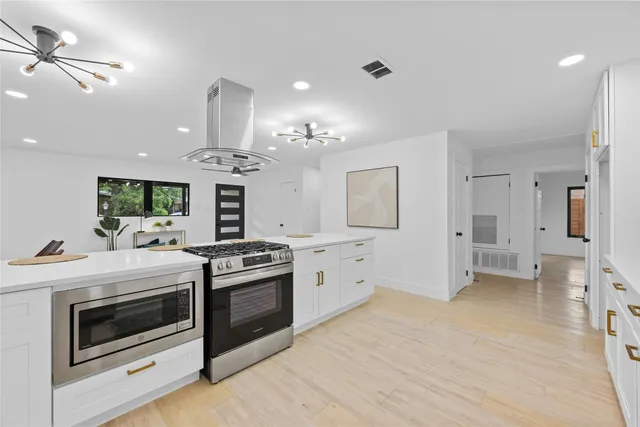 a kitchen with a stove oven and a refrigerator