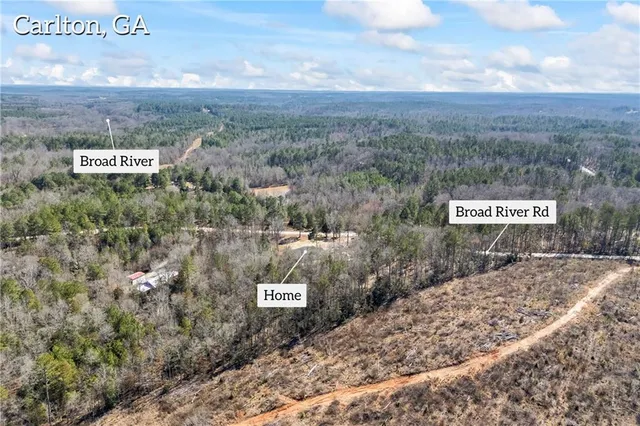 a view of a small space with wooden floor and a window