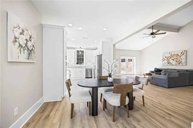 a view of an empty room and a ceiling fan