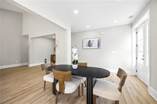 a bathroom with a double vanity sink toilet and a mirror