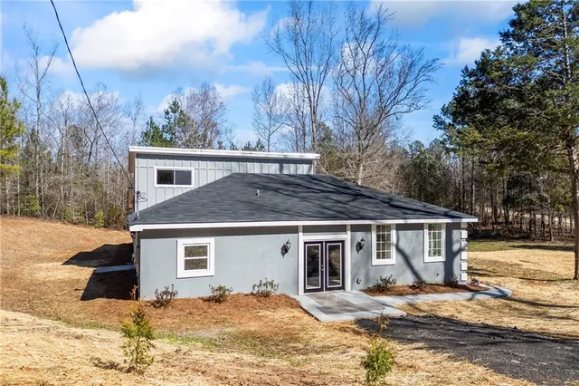 a kitchen with stainless steel appliances granite countertop a stove and a microwave