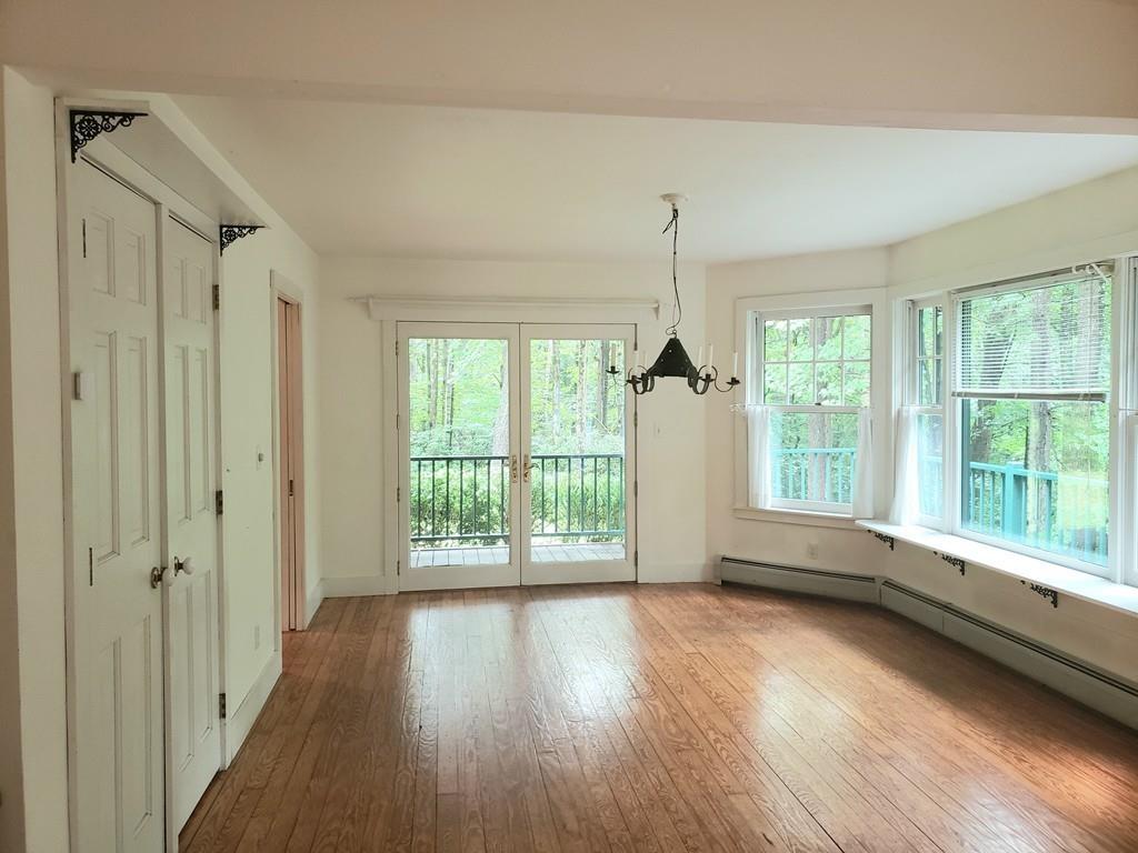 115 Audubon Road Northampton, MA 01053 - Photo 8 of 30 a view of an empty room with wooden floor and a window