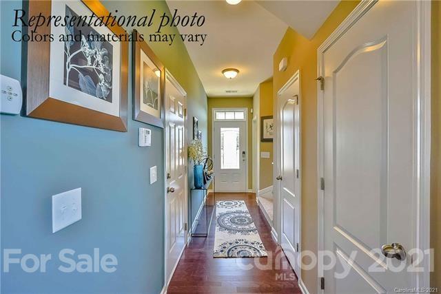 1665 Corwin Bend Road Tega Cay, SC 29708 - Photo 2 of 11 a view of a hallway with wooden floor