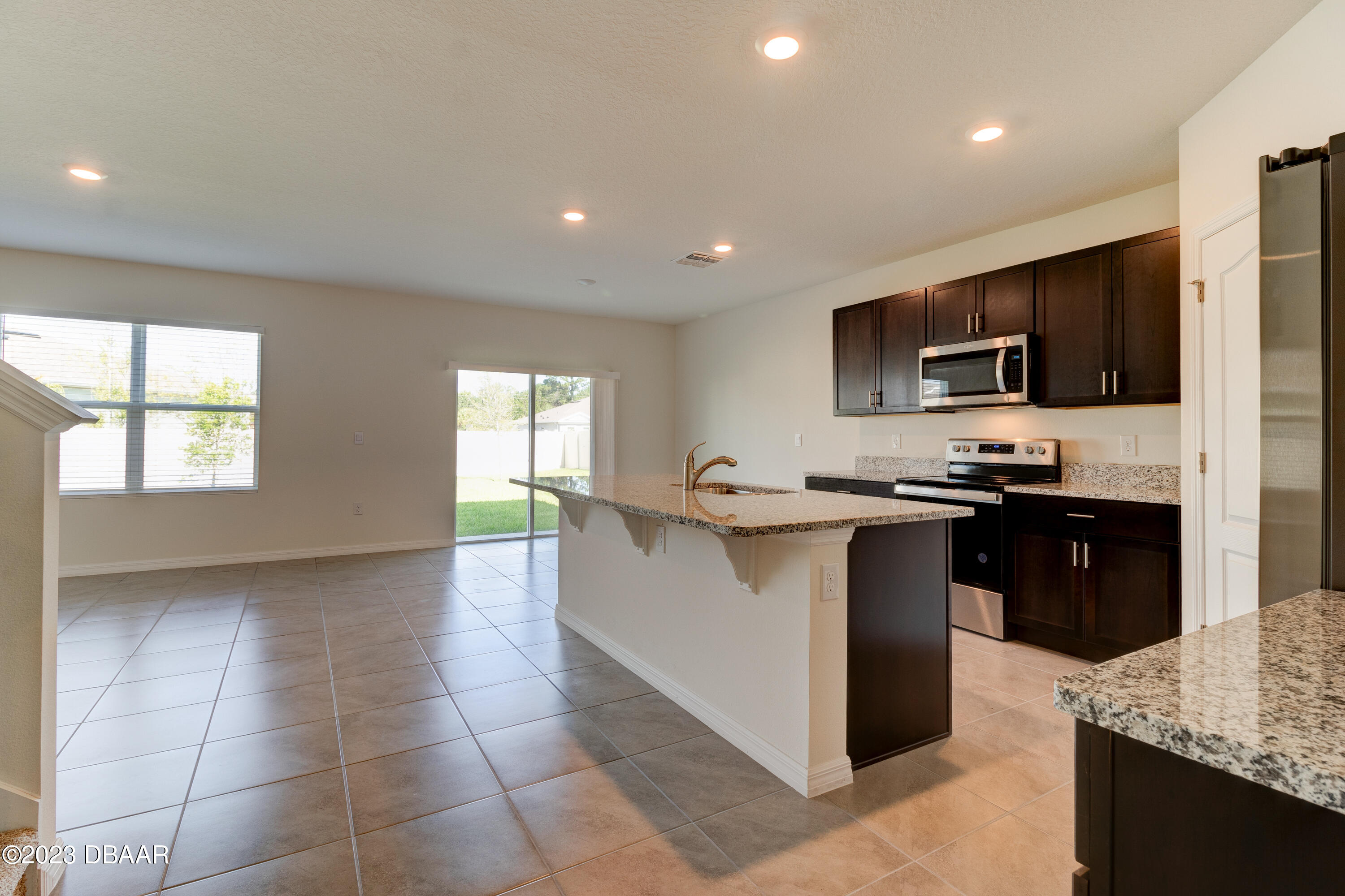 60 Trailmark Court Ormond Beach, FL 32174 - Photo 4 of 21 kitchen to backyard