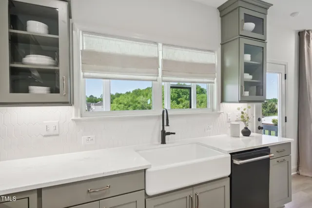 a bedroom with bed and a window