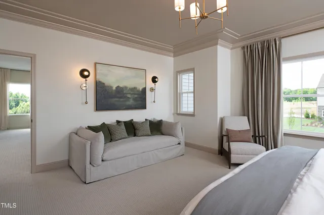 a front view of a house with sitting area and garden