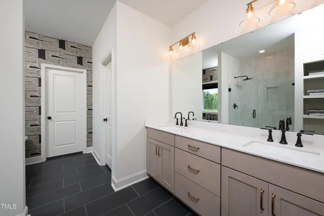 a view of a patio with table and chairs under an umbrella