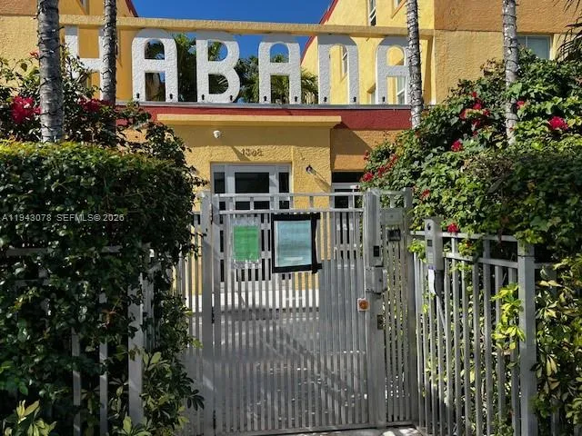 a view of a house with a small yard and plants