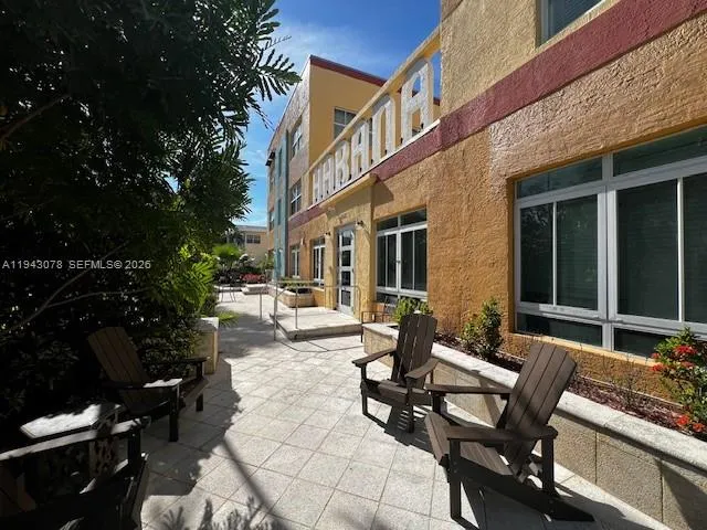 a view of a building with outdoor seating