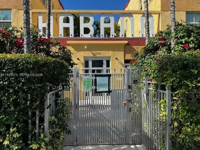 a view of a house with a flower garden