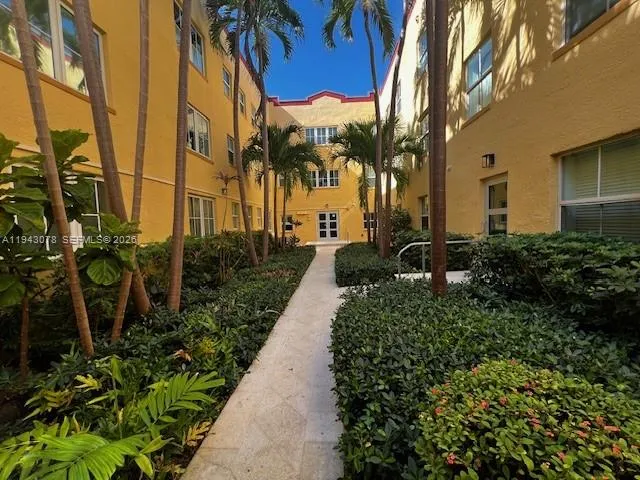 a view of a pathway with a building in the background