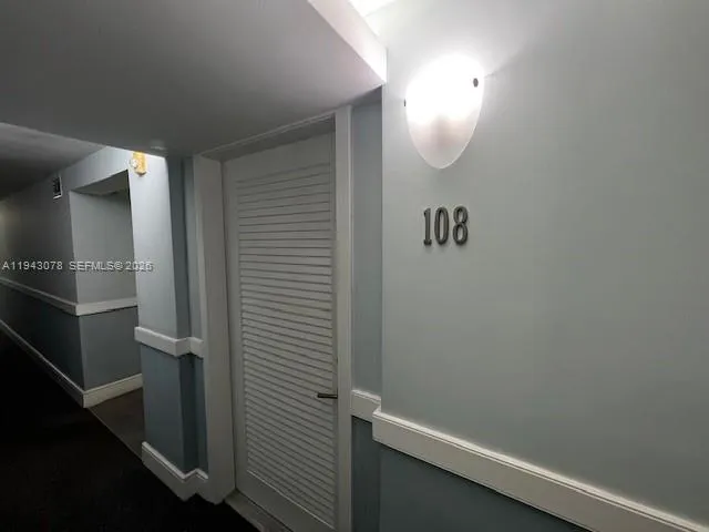 view of a room with rack on the wall