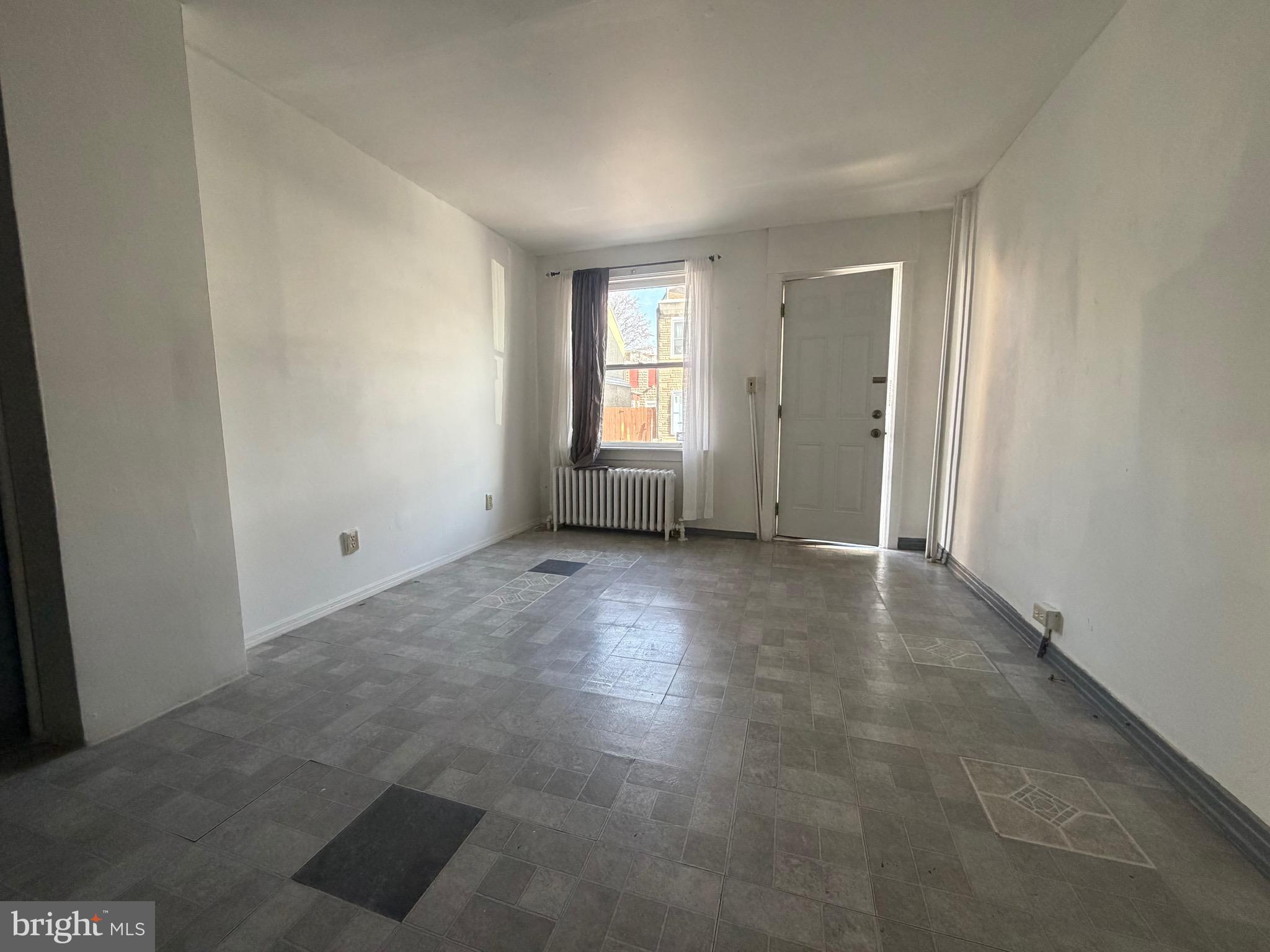 318 South 11th Street Reading, PA 19602 - Photo 5 of 21 an empty room with windows and entrance