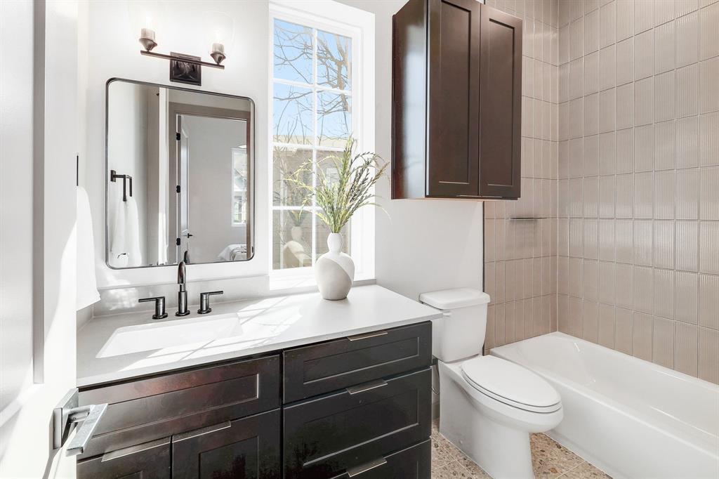 1732 Bunche Road, Unit B2 Austin, TX 78721 - Photo 15 of 22 a bathroom with a sink a toilet and shower