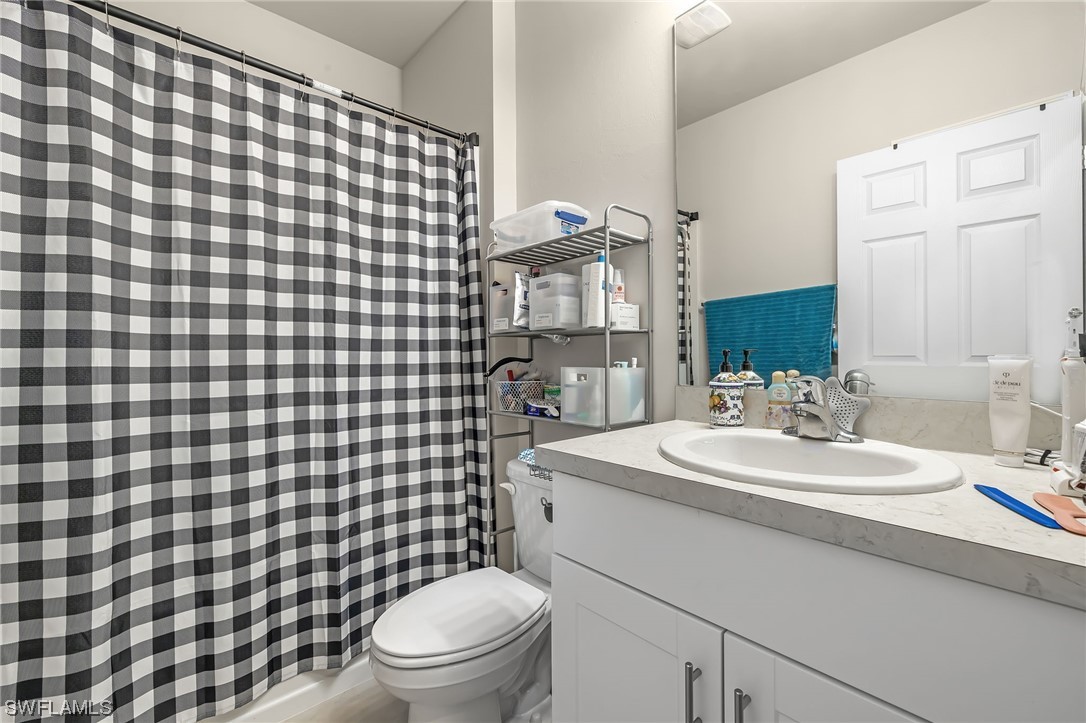 17504 Oriole Road Fort Myers, FL 33967 - Photo 17 of 23 a bathroom with a sink toilet and shower