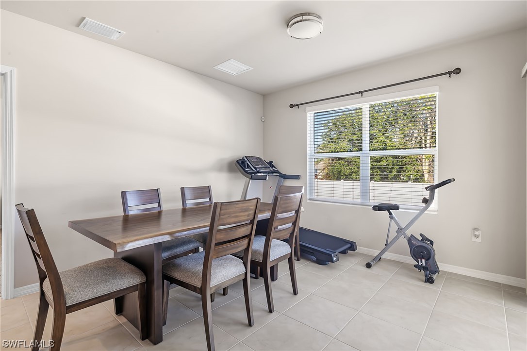 17504 Oriole Road Fort Myers, FL 33967 - Photo 8 of 23 a workspace with furniture and a window