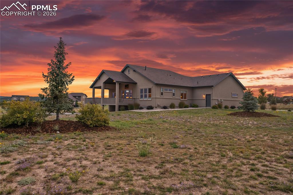 3718 Sky Rim Court Colorado Springs, CO 80908 - Photo 5 of 49 Looking from the SW corner of the lot. The rear of the home faces West and this is the view from the street perspective.