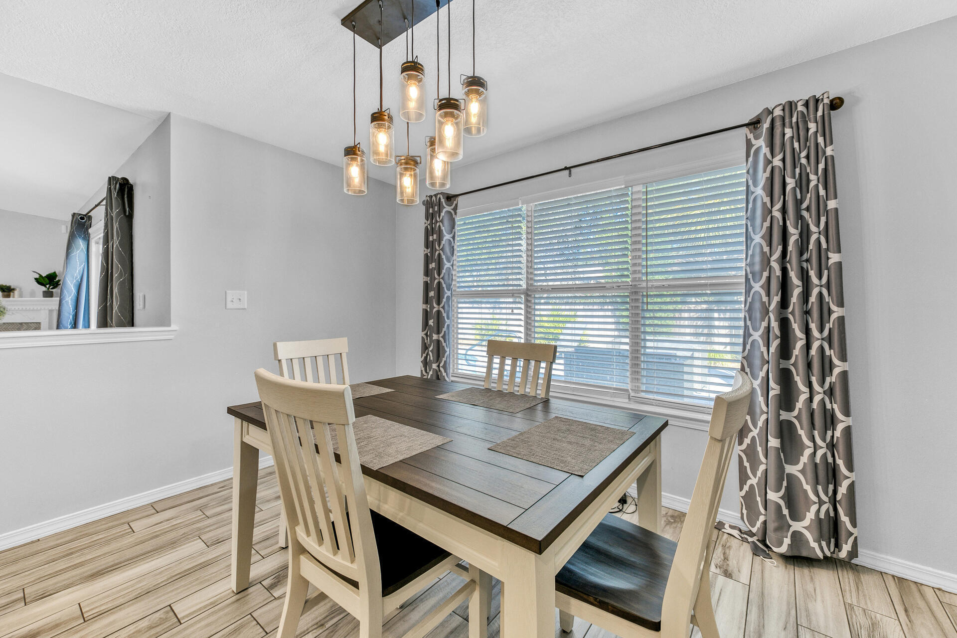 606 Risen Star Drive Crestview, FL 32539 - Photo 14 of 37 a view of a dining room with furniture and wooden floor