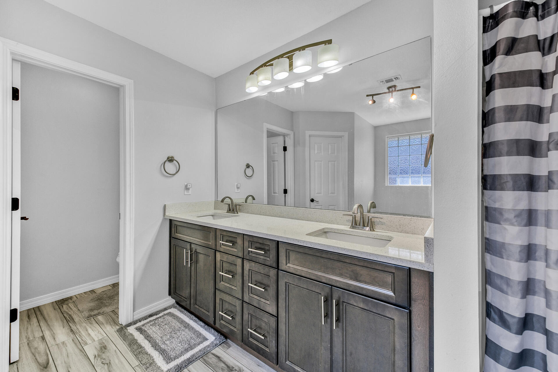 606 Risen Star Drive Crestview, FL 32539 - Photo 19 of 37 a bathroom with a double vanity sink mirror and double