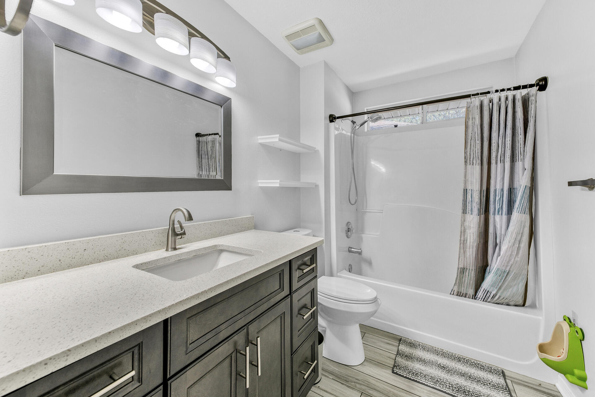 606 Risen Star Drive Crestview, FL 32539 - Photo 25 of 37 a bathroom with a sink toilet and shower
