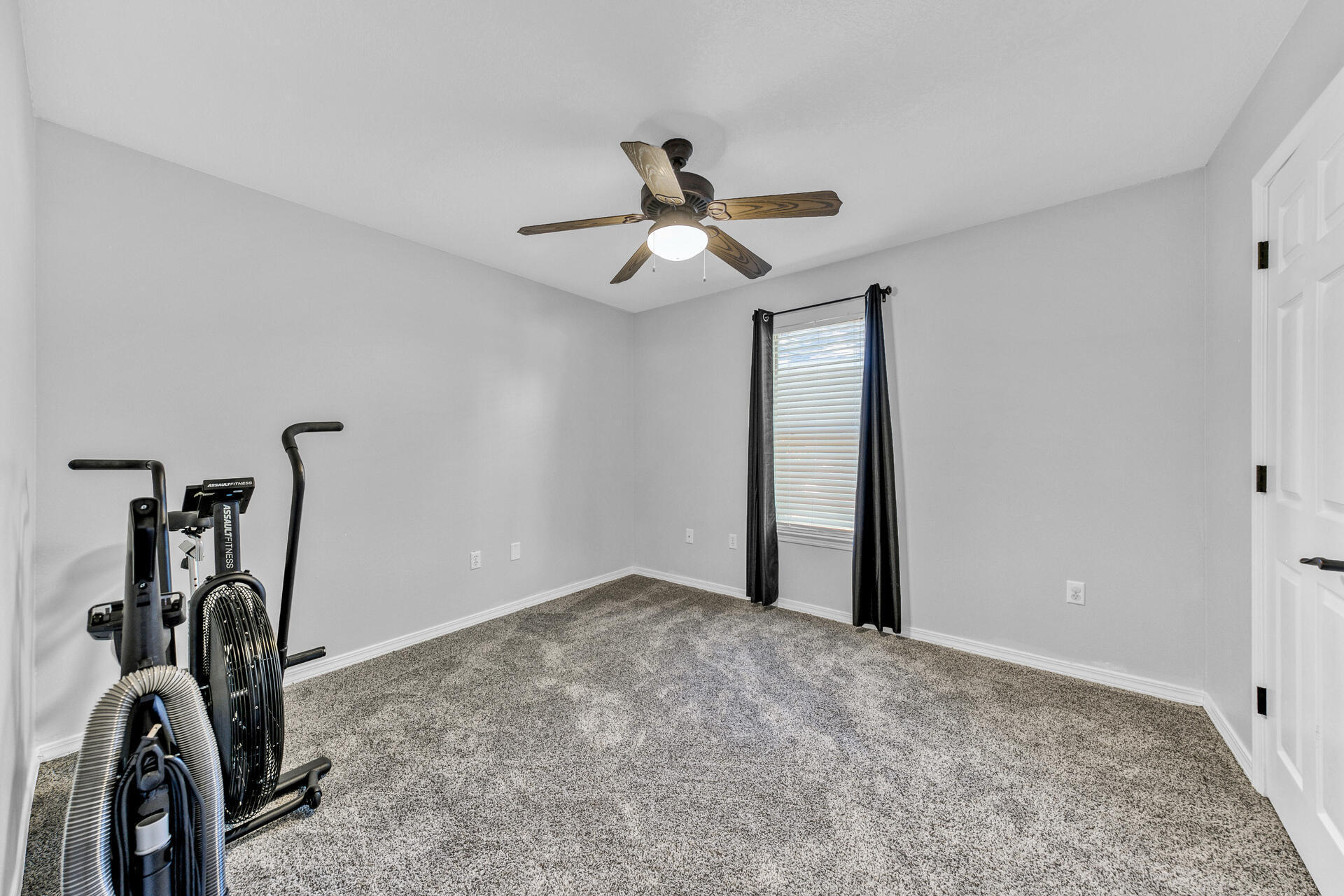 606 Risen Star Drive Crestview, FL 32539 - Photo 26 of 37 a view of a room with gym equipment