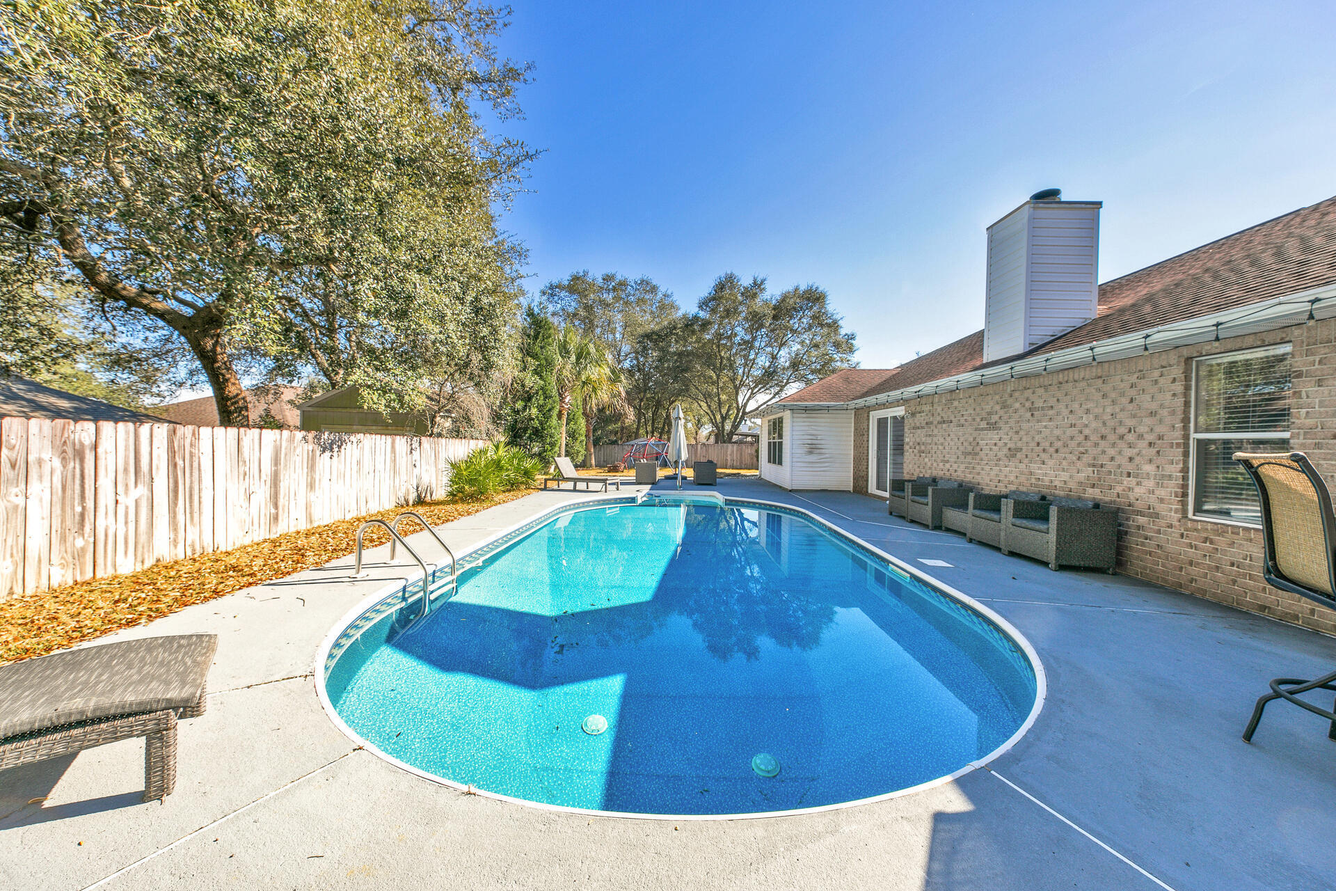 606 Risen Star Drive Crestview, FL 32539 - Photo 31 of 37 a view of a swimming pool with a patio