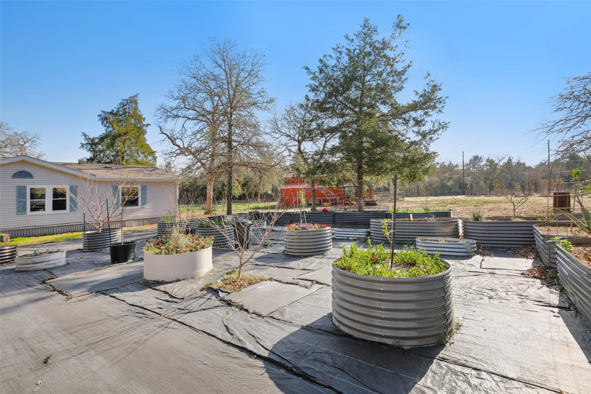 6975 Silvermine Road Harwood, TX 78632 - Photo 1 of 33 a view of a patio with couches chairs and a potted plant