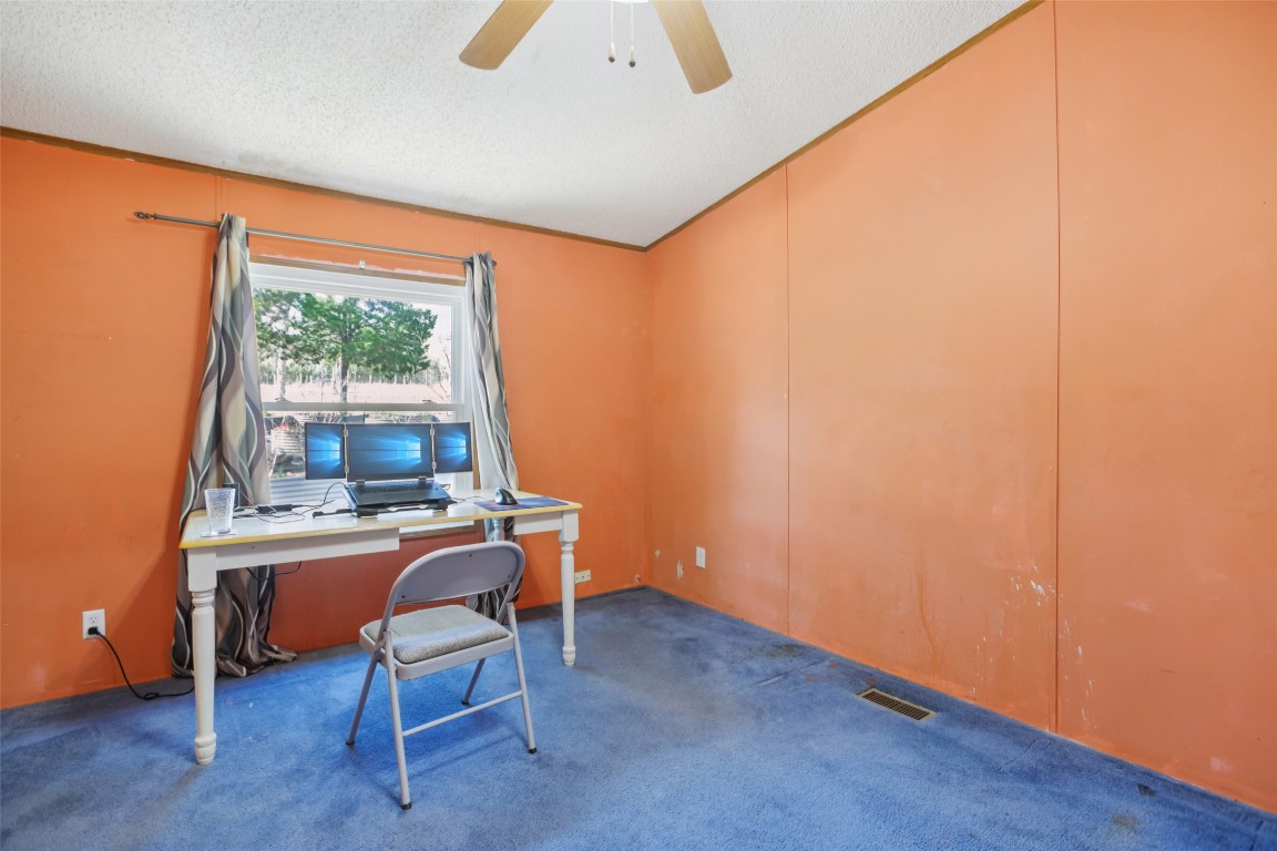 6975 Silvermine Road Harwood, TX 78632 - Photo 12 of 33 a view of a workspace with furniture and a window