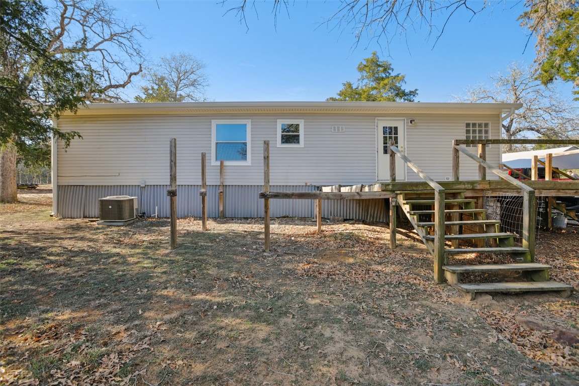 6975 Silvermine Road Harwood, TX 78632 - Photo 24 of 33 a view of a house with wooden fence