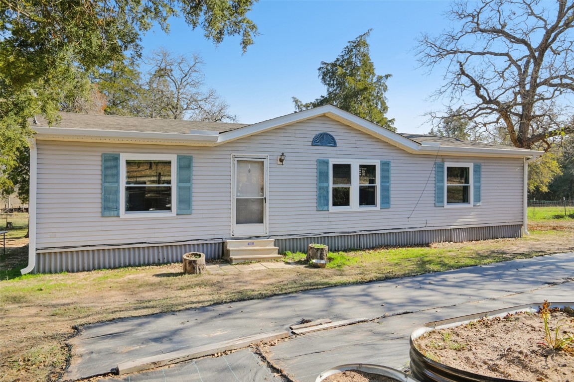 6975 Silvermine Road Harwood, TX 78632 - Photo 3 of 33 a front view of a house with a yard