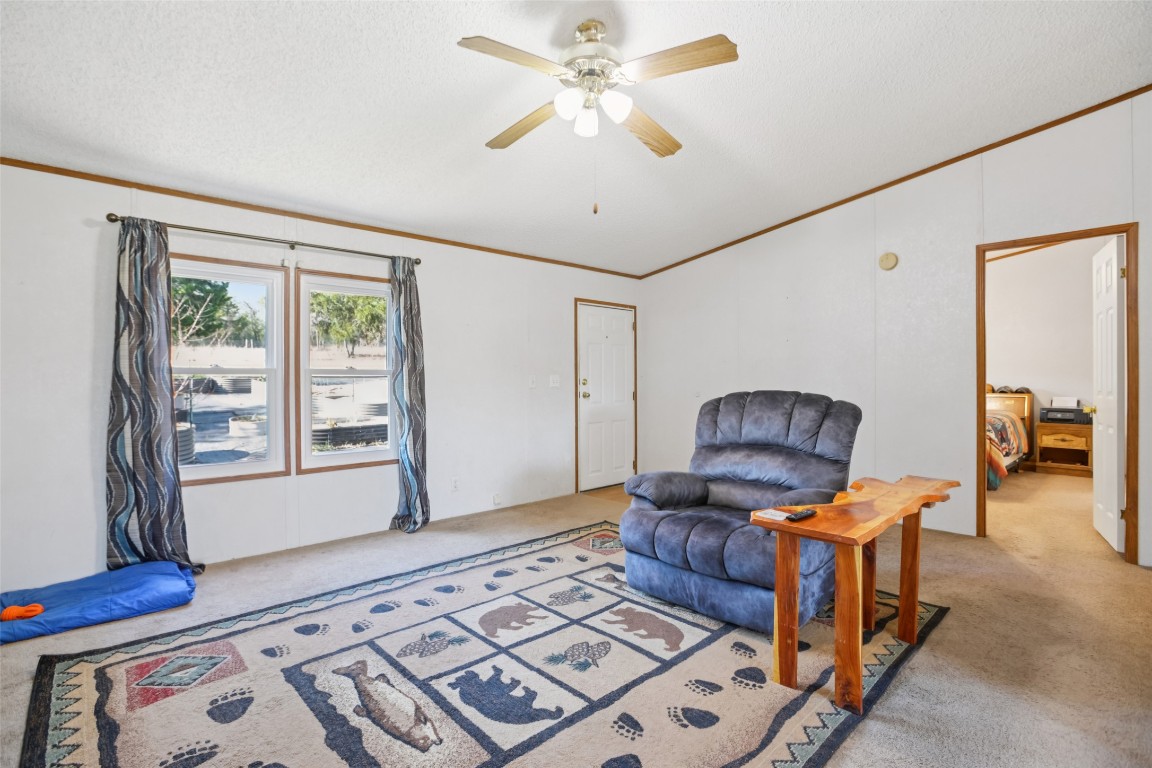 6975 Silvermine Road Harwood, TX 78632 - Photo 6 of 33 a living room with furniture and a window