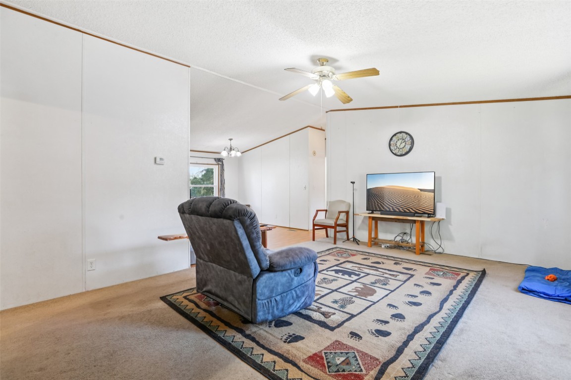 6975 Silvermine Road Harwood, TX 78632 - Photo 7 of 33 a living room with furniture and a flat screen tv