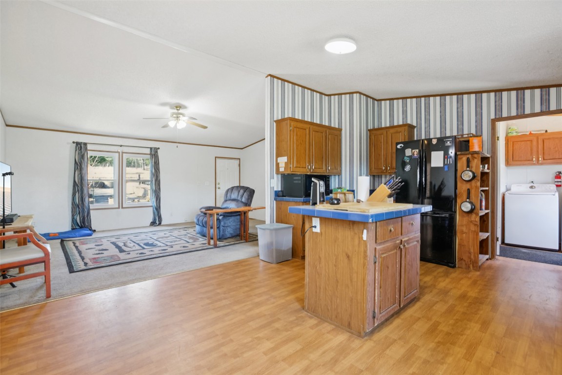 6975 Silvermine Road Harwood, TX 78632 - Photo 10 of 33 a living room with furniture and a flat screen tv