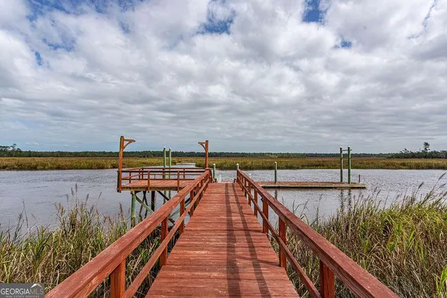 a view of swimming pool with a balcony